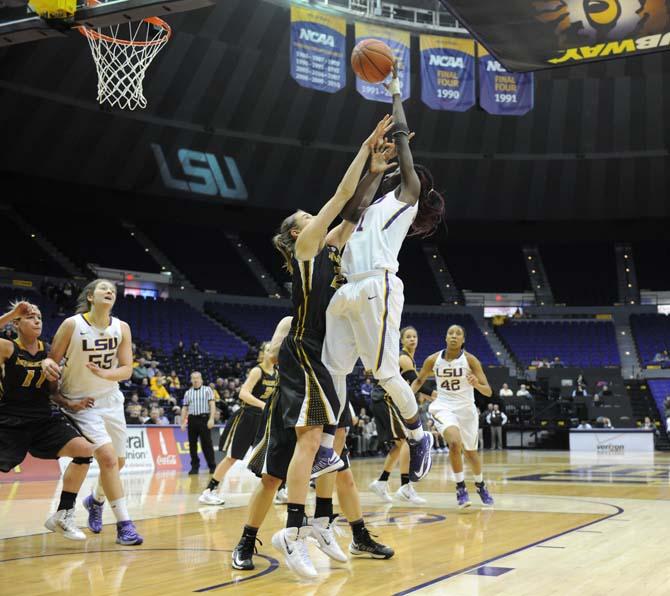 LSU freshman guard Raigyne Moncrief (11) attempts a shot Thursday, Feb. 6, 2014 during the Tigers' 75-58 victory against Missouri at the PMAC.