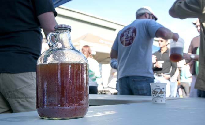 A growler full of beer sits on a back table while representatives pour samples Saturday, Feb. 15, 2014 during the 2014 Brasseurs a la Maison Iron Brewer Festival at Tin Roof Brewing Company in Baton Rouge.