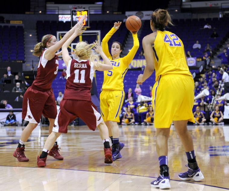 LSU sophomore guard Anne Pedersen (4) passes the ball to LSU junior forward Sheila Boykin (42) Sunday, Feb. 23, 2014 during the Tigers' 57-53 loss against the Razorbacks in the Pete Maravich Assembly Center.