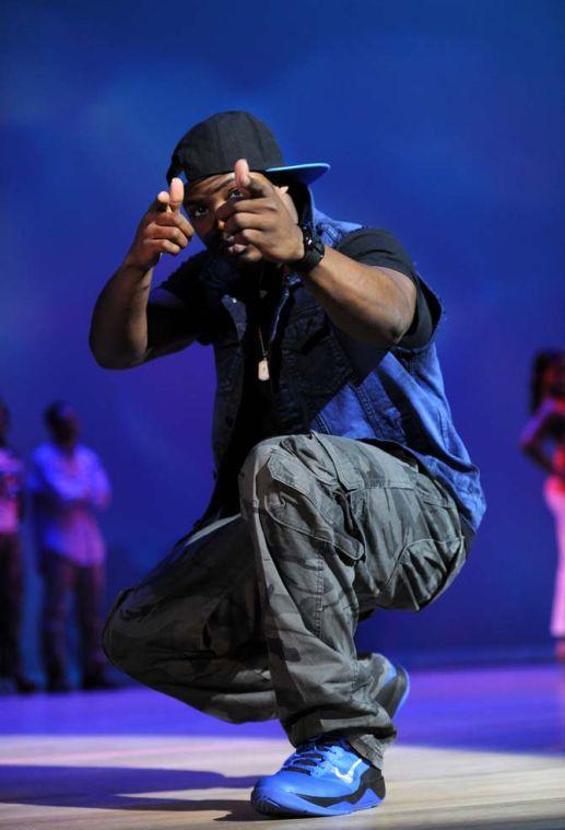 Sociology junior Denzell Jackson strikes a pose Tuesday, Feb. 4, 2014 during the Mister and Miss Imani Scholarship Pageant: “A Walk in Their Shoes…” in the LSU Union Theatre.