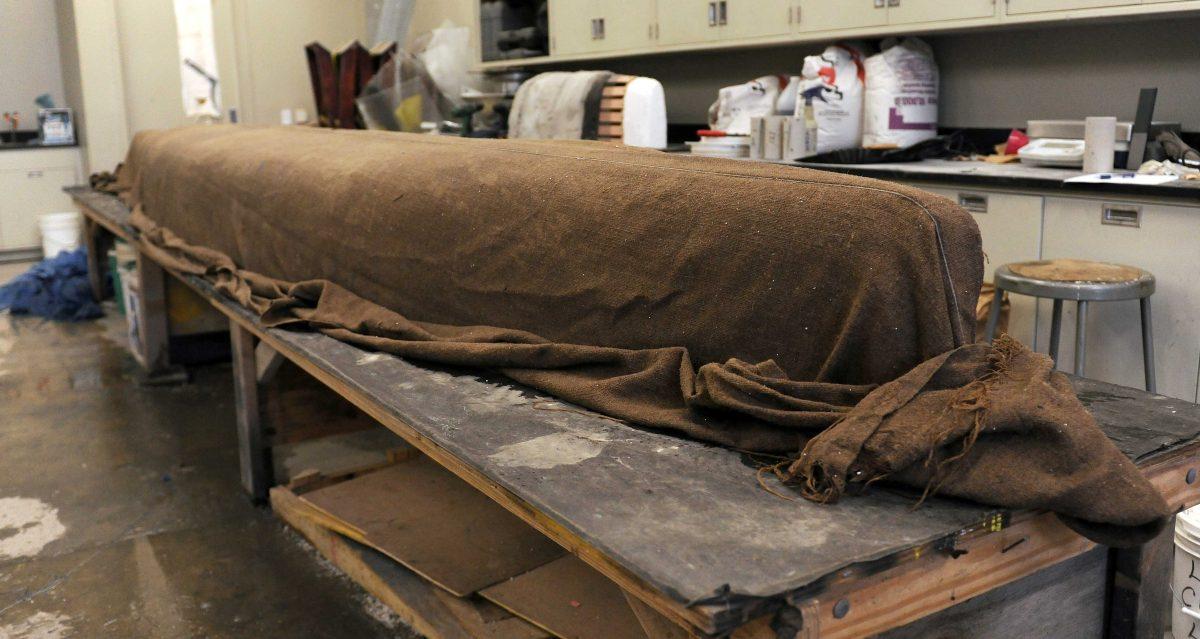 A burlap blanket is wet twice a day to help with the curing process for the concrete canoe for the American Society of Civil Engineerings' Deep South Regional Student Conference in Memphis, Tennessee in March.