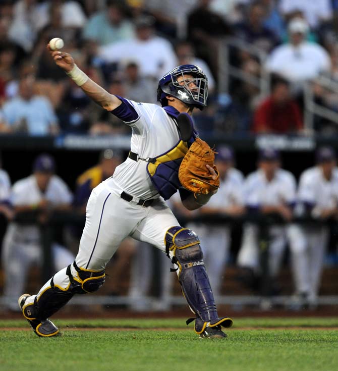 LSU junior catcher Ty Ross (26) throws the ball to first base June 16, 2013 during LSU's 2-1 loss against UCLA at the College World Series in TD Ameritrade Park.