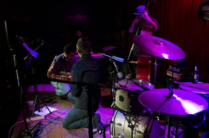 Brad Webb's Making Faces' Reagan Mitchell, alto sax, Brad Walker, tenor sax, and Trey Boudreaux, bass, take a small rest as they performed Thursday, Feb. 13 2014 at Mud and Water.