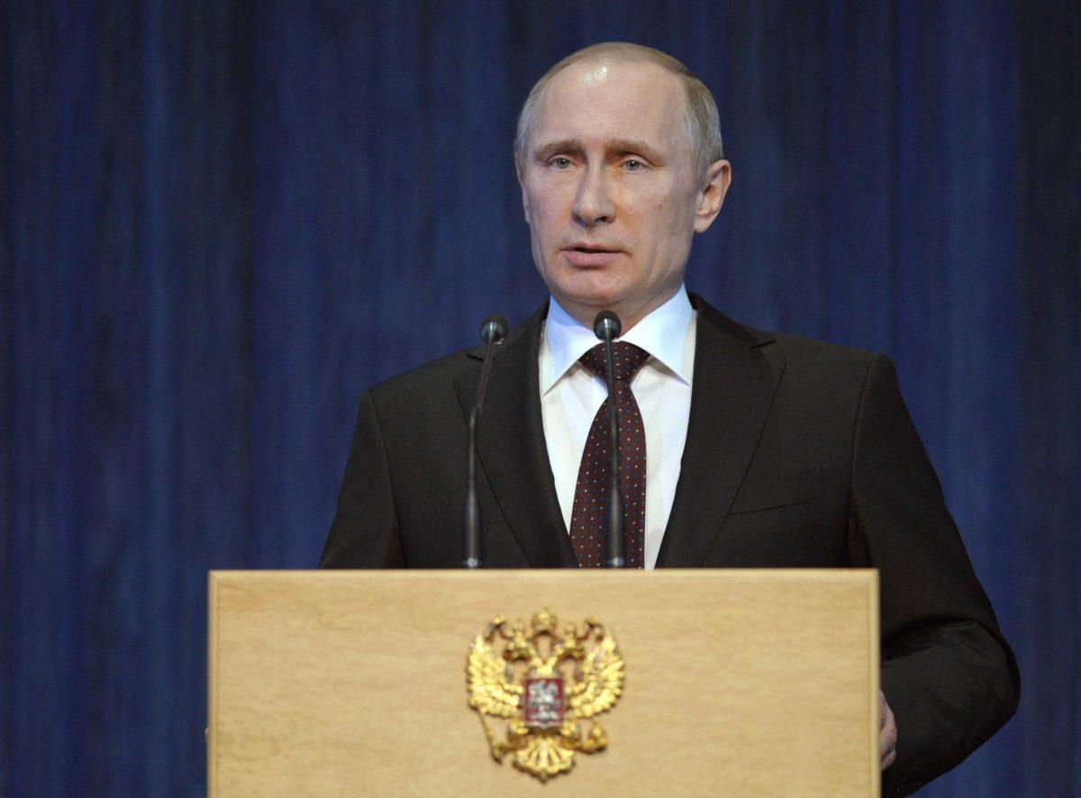 Russian President Vladimir Putin delivers his speech prior to a concert marking the Defenders of the Fatherland Day, celebrated in Russia on Feb. 23, which honors the nation's military and is a nationwide holiday, in Moscow, Russia, Thursday, Feb. 20, 2014. Putin pledged that the government will continue efforts to modernize the Russian military.(AP Photo/RIA-Novosti, Alexei Druzhinin, Presidential Press Service)