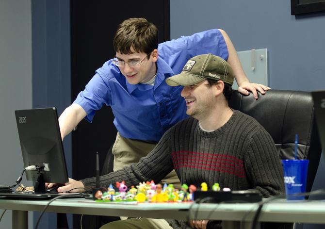 Brothers Matthew (left) and Mike (right) at Level Up Lab preparing their new game, Tadpole Treble, for release.