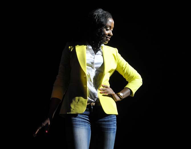 Broadcast journalism junior Kendra Turley glances down at the judges Tuesday, Feb. 4, 2014 during the Mister and Miss Imani Scholarship Pageant: “A Walk in Their Shoes…” in the LSU Union Theatre.