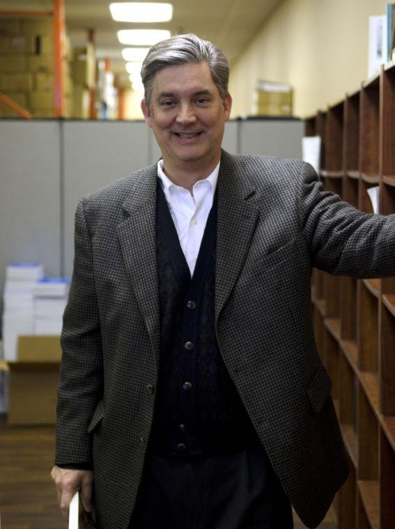 Senator Dan Claitor laughs before having his photograph taken at Claitor's Law Books &amp; Publishing Div.