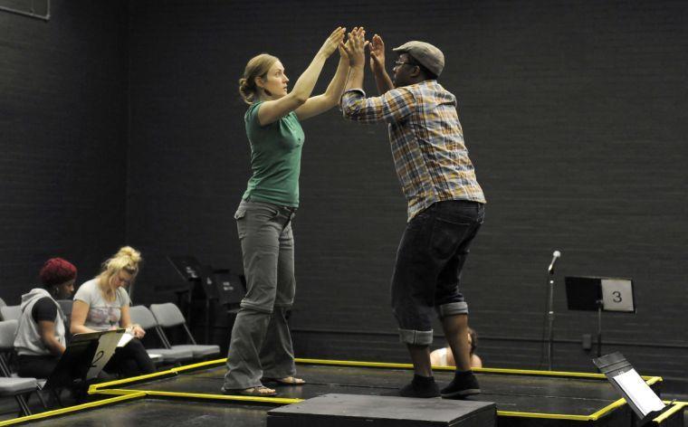 Bonny McDonald and Douglas Mungin run through scenes during rehearsal for Sojourn Theatre&#8217;s &#8220;How to End Poverty in 60 Minutes&#8221; on Wednesday evening, Feb. 19, 2014 in the HopKins Black Box Theatre at 137 Coates Hall.