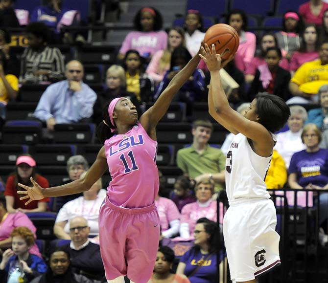 LSU freshman guard Raigyne Moncrief (11) blocks a shot Sunday, Feb. 16, 2014 during the Tigers' 57-73 loss to South Carolina in the PMAC.