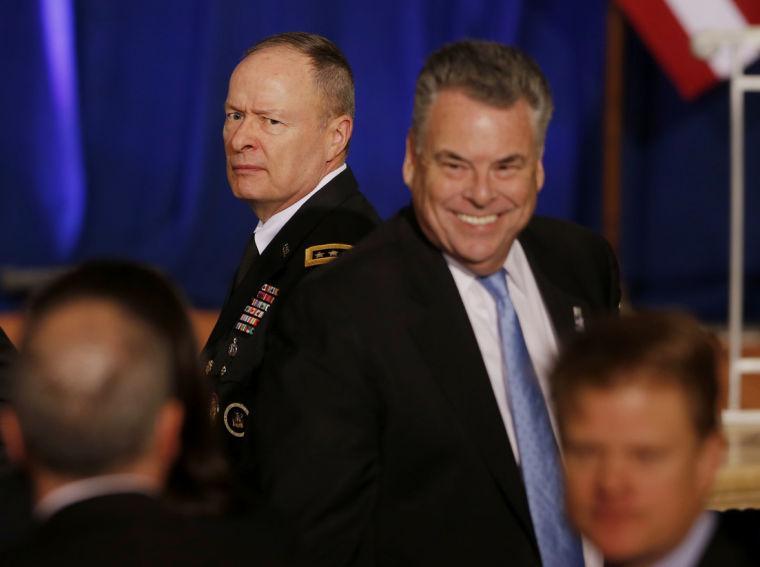 National Security Agency Director Gen. Keith Alexander, left, and Rep. Peter King, R-N.Y., a member of the House Intelligence and Homeland Security Committees, stand after President Barack Obama spoke about National Security Agency (NSA) surveillance, Friday, Jan. 17, 2014, at the Justice Department in Washington. Seeking to calm a furor over U.S. surveillance, President Barack Obama on Friday called for ending the government's control of phone data from hundreds of millions of Americans and immediately ordered intelligence agencies to get a secretive court's permission before accessing such records. (AP Photo/Charles Dharapak)