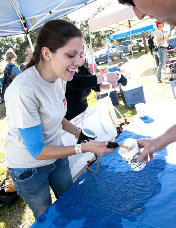 A brewer pours beer from a tap Saturday, Feb. 15, 2014 during the 2014 Brasseurs a la Maison Iron Brewer Festival at Tin Roof Brewing Company in Baton Rouge.