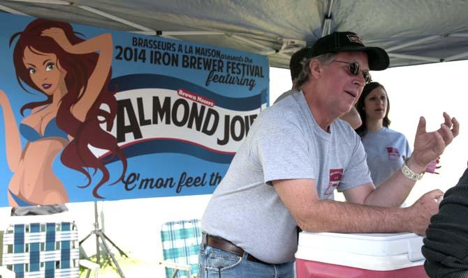 A representative explains a brew to a group of patrons Saturday, Feb. 15, 2014 during the 2014 Brasseurs a la Maison Iron Brewer Festival at Tin Roof Brewing Company in Baton Rouge.