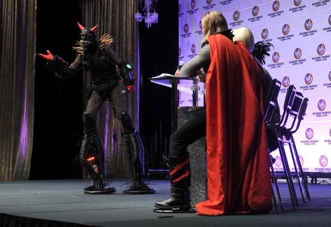 Joe Raymond cosplays as "Arkicide" Saturday, Feb. 8, 2014 during the Wizard World Comic Con costume contest helt in the New Orleans Theater. Raymond finsihed the night voted best male villian in the singles category.