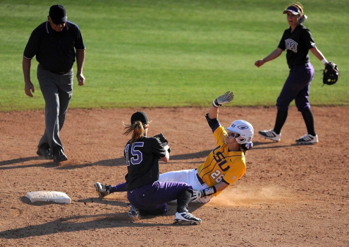 LSU freshman outfielder Bailey Landry (26) slides safely into second Sunday, Feb. 9, 2014 during the Lady Tigers' 8-1 victory against Central Arkansas at Tiger Park.