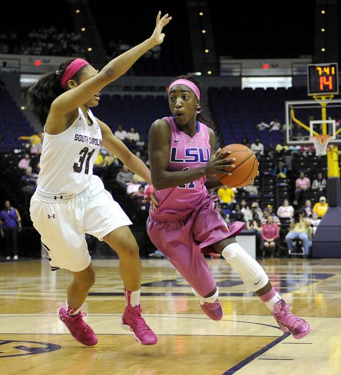 LSU freshman guard Raigyne Moncrief (11) drives around a defender Sunday, Feb. 16, 2014 during the Tigers' 57-73 loss to South Carolina in the PMAC.