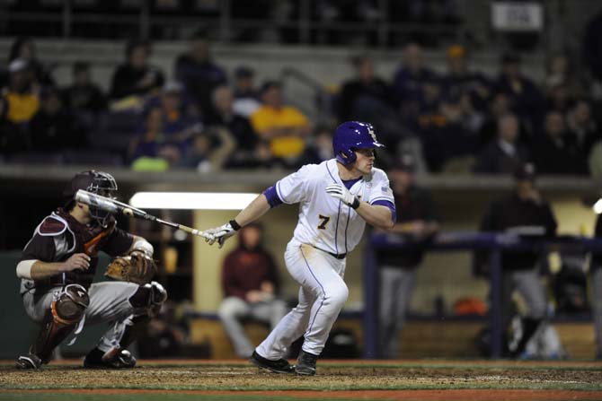 LSU senior outfielder Sean McMullen (7) hits a homerun Friday, Feb. 21, 2014 during the Tigers 9-0 victory against Virginia Tech at Alex Box Stadium.