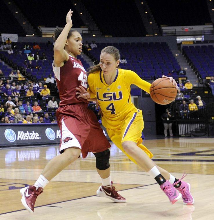 LSU sophomore guard Anne Pedersen (4) navigates around an Arkansas defender Sunday, Feb. 23, 2014 during the Tigers' 57-53 loss against the Razorbacks in the Pete Maravich Assembly Center.