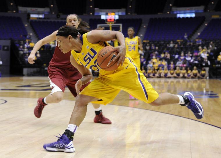 LSU sophomore guard Danielle Ballard (32) dribbles down the court Sunday, Feb. 23, 2014 during the Tigers' 57-53 loss against the Razorbacks in the Pete Maravich Assembly Center.