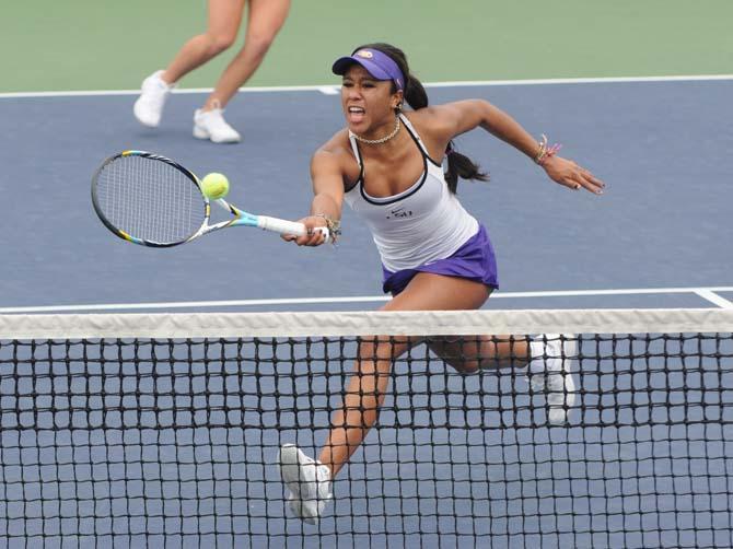 LSU junior tennis player Noel Scott hits the ball Sunday, Feb. 16, 2014 in a doubles match against Northwestern State University at W.T. "Dub" Robinson Stadium.