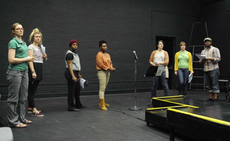 (From left to right) Bonny McDonald, Sarah Friday, Tarnashia Russell, Cessali Fournier, Stephanie Heath, Emily Graves, and Douglas Mungin rehearse for Sojourn Theatre&#8217;s &#8220;How to End Poverty in 60 Minutes&#8221; on Wednesday evening, Feb. 19, 2014 in the HopKins Black Box Theatre at 137 Coates Hall.