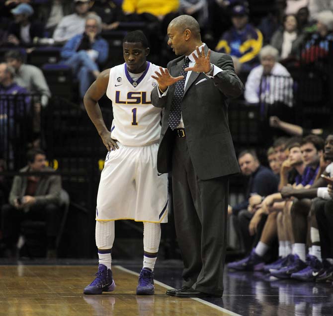 LSU basketball coach Johnny Jones talks to junior guard Anthony Hickey (1) on Tuesday, Jan. 21, 2014, during the Tigers' 77-71 win against Mizzou in the PMAC.