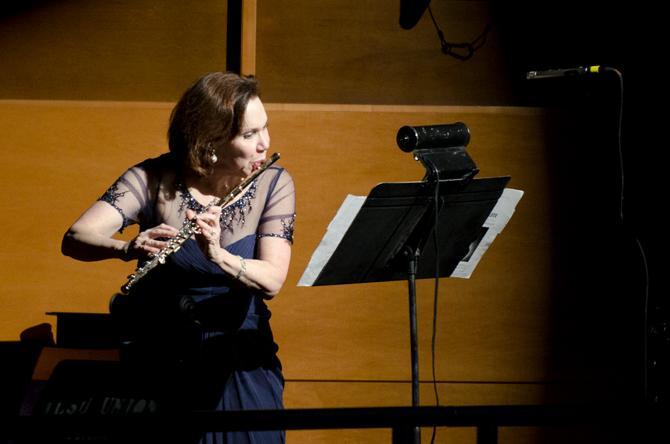 A member of the Wind Ensemble performing a beatboxing flute solo at the Concert Spectacular at LSU's Union Theate.