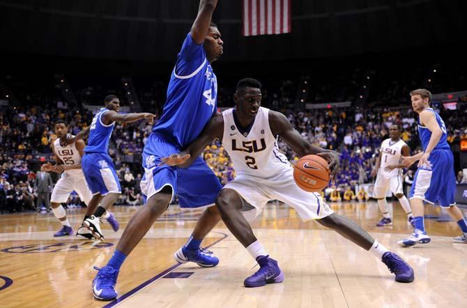 LSU junior forward Johnny O'Bryant III (2) attempts to move past a Kentucky defender Tuesday, Jan. 28, 2014 during the Tigers' 87-82 victory against the Wildcats.