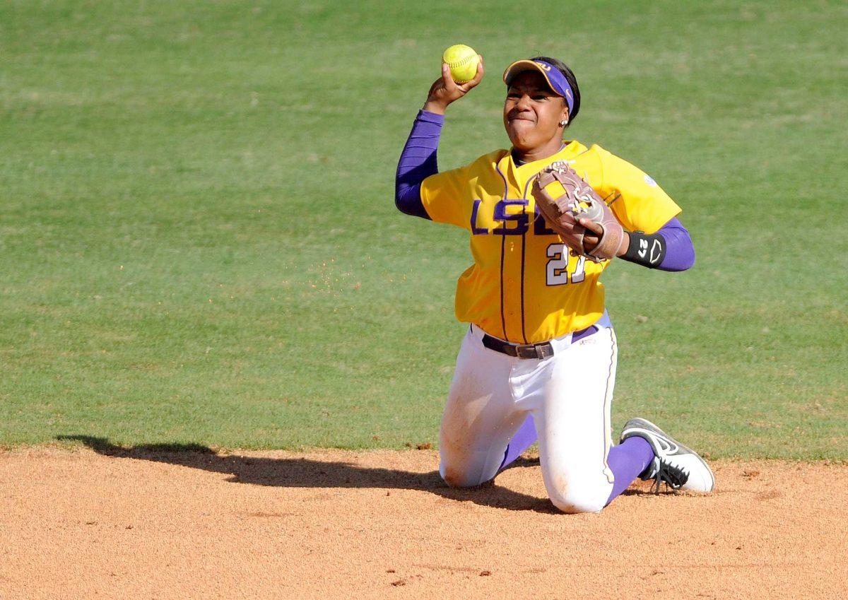 LSU sophomore infielder Bianka Bell (27) attempts a throw to first Sunday, Feb. 9, 2014 during the Lady Tigers' 8-1 victory against Central Arkansas at Tiger Park.