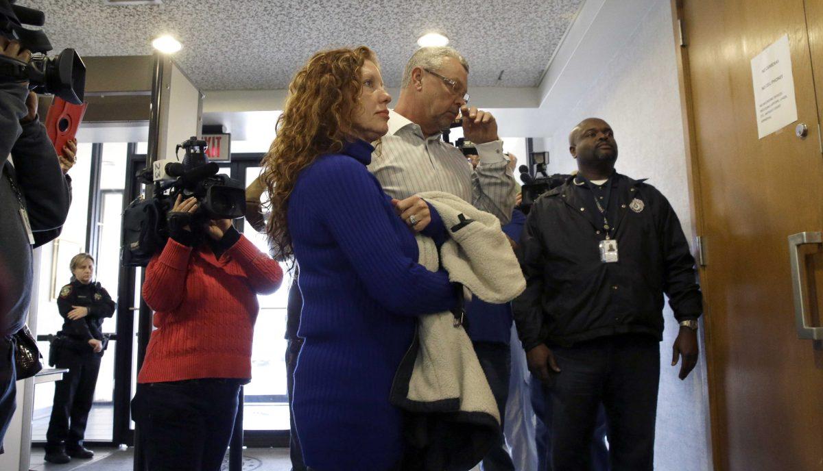 Tonya Couch, left, and Fred Couch, parents of teenager Ethan Couch, arrive at juvenile court for a hearing about their son's future Wednesday, Feb. 5, 2014, in Fort Worth, Texas. Judge Jean Boyd again decided to give no jail time for Ethan Couch, who was sentenced to 10 years' probation in a drunken-driving crash that killed four people, and ordered him to go to a rehabilitation facility paid for by his parents. The sentence stirred fierce debate, as has the testimony of a defense expert who says Couch's wealthy parents coddled him into a sense of irresponsibility. The expert termed the condition "affluenza." (AP Photo/LM Otero)