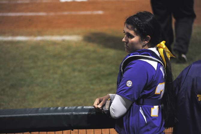 LSU sophomore catcher Kellsi McCasland looks on at her teammates as they attempt to catch up during their first match of the season Thursday, Feb. 6, 2014 against Texas. The Lady Tigers' were defeated by the Longhorns 6-1.