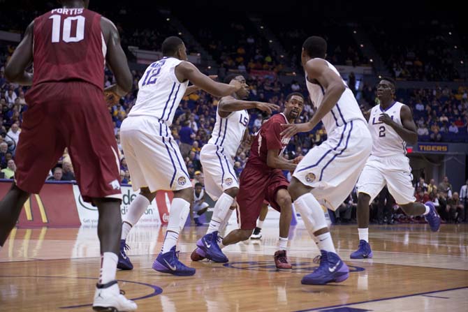 LSU players surround Rashad Madden (00), junior guard for Arkansas, on Saturday, Feb. 2, 2014, durind the Tigers' 88-74 win against the Razorbacks.