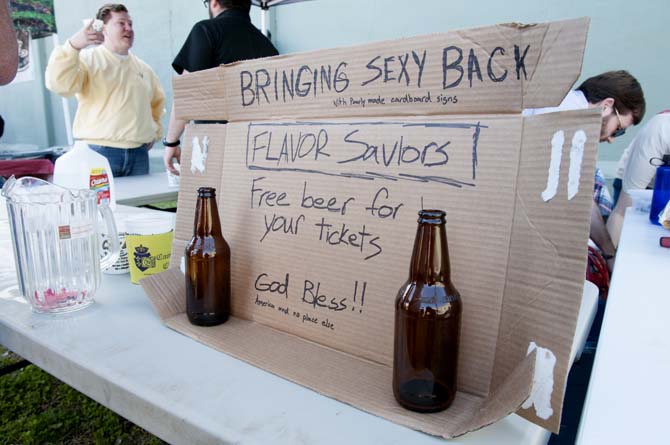 Empty bottles and a handmade sign sit on display at a booth Saturday, Feb. 15, 2014 during the 2014 Brasseurs a la Maison Iron Brewer Festival at Tin Roof Brewing Company in Baton Rouge.