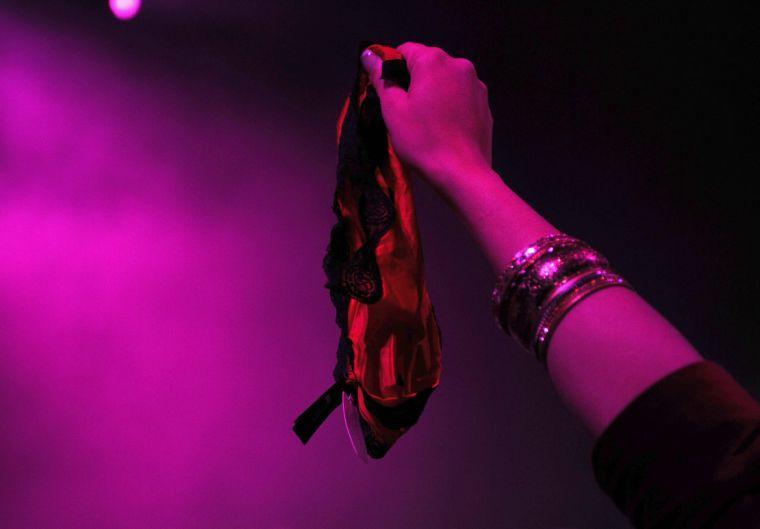 A fan offers her panties to R. Kelly Thursday night, February 13, 2014 downtown at the Baton Rouge River Center.