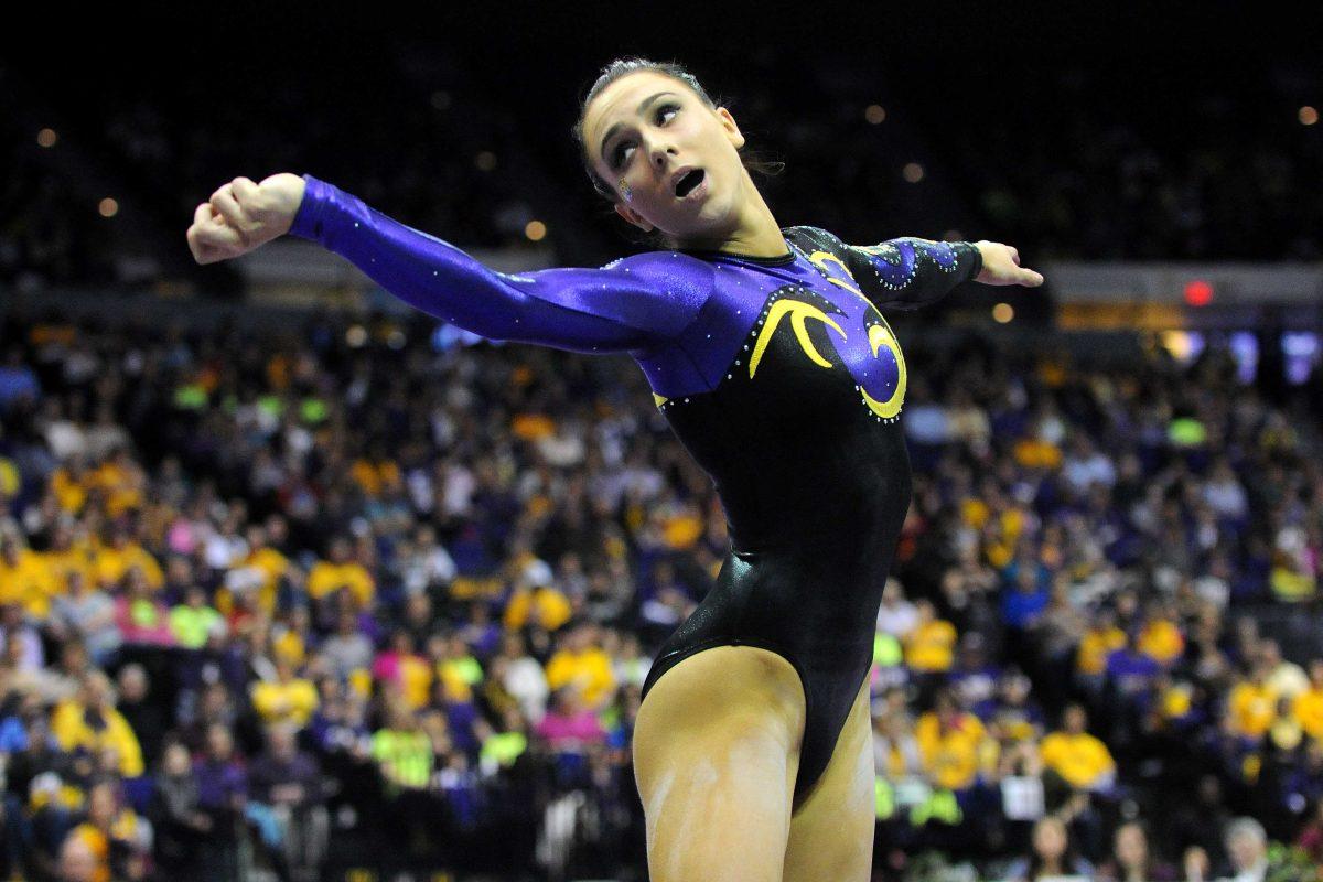 LSU junior all-around gymnast Rheagan Courville dances during her floor routine Friday, Jan. 31, 2014 during the Tigers' 197.650-196.825 victory against Alabama in the PMAC.