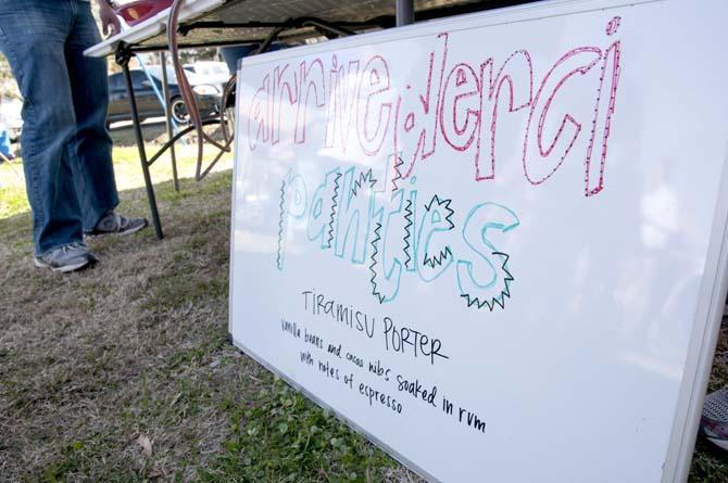 A decorative sign sits on display at a booth Saturday, Feb. 15, 2014 during the 2014 Brasseurs a la Maison Iron Brewer Festival at Tin Roof Brewing Company in Baton Rouge.