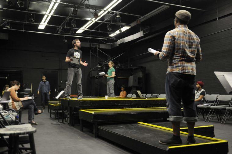 Ari Gratch rehearses his lines for Sojourn Theatre&#8217;s &#8220;How to End Poverty in 60 Minutes&#8221; on Wednesday evening, Feb. 19, 2014 in the HopKins Black Box Theatre at 137 Coates Hall.