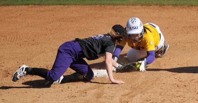 LSU sophomore infielder Hailey Smith (21) slides safely into second Sunday, Feb. 9, 2014 during the Lady Tigers' 8-1 victory against Central Arkansas at Tiger Park.