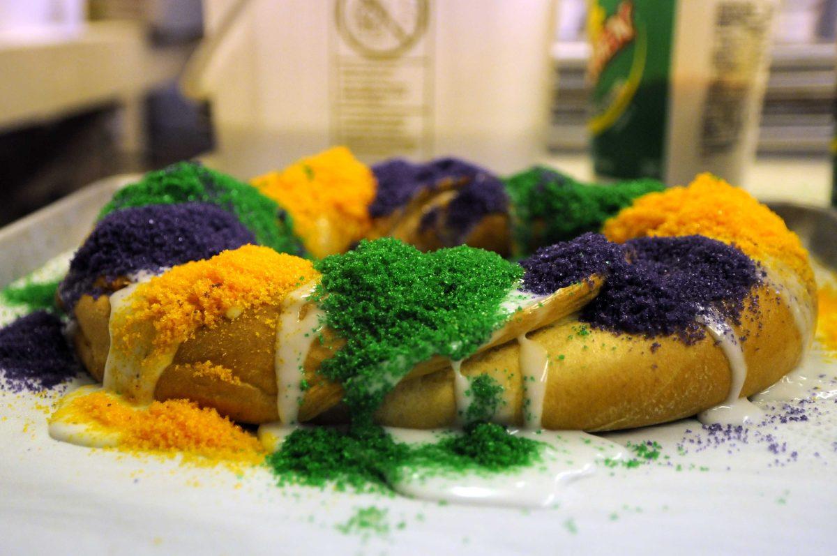 A freshly decorated king cake sits on a pan Wednesday, Feb. 26, 2014 at Baum's Fine Pastries and Chocolates on Florida Blvd.