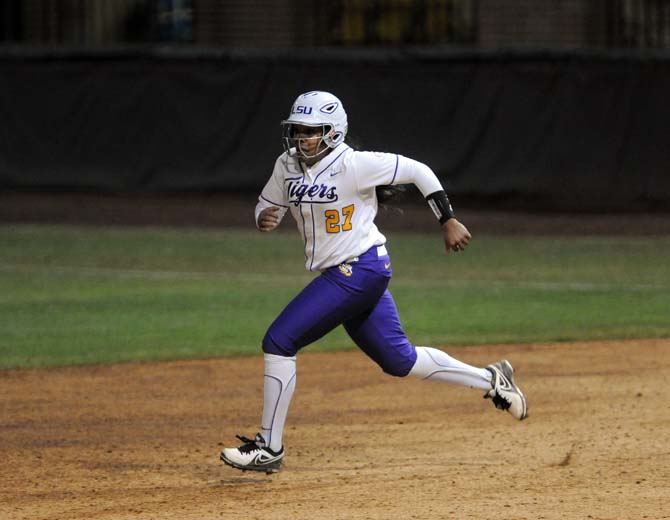 LSU sophomore infielder Bianka Bell (27) runs to second base Saturday, Feb. 8, 2014 during the Tigers' 1-0 win against Oklahoma State in Tiger Park.