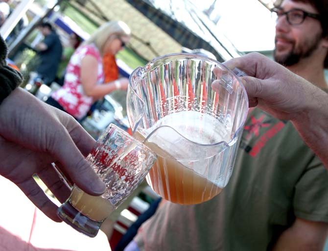 A brewer pours beer from a pitcher Saturday, Feb. 15, 2014 during the 2014 Brasseurs a la Maison Iron Brewer Festival at Tin Roof Brewing Company in Baton Rouge.