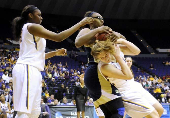 LSU senior guard Theresa Plaisance (55) is fowled by a Georgia Tech defender Sunday, March 23, 2014, after the Tigers' 98-78 victory against Georgia Tech in the PMAC.