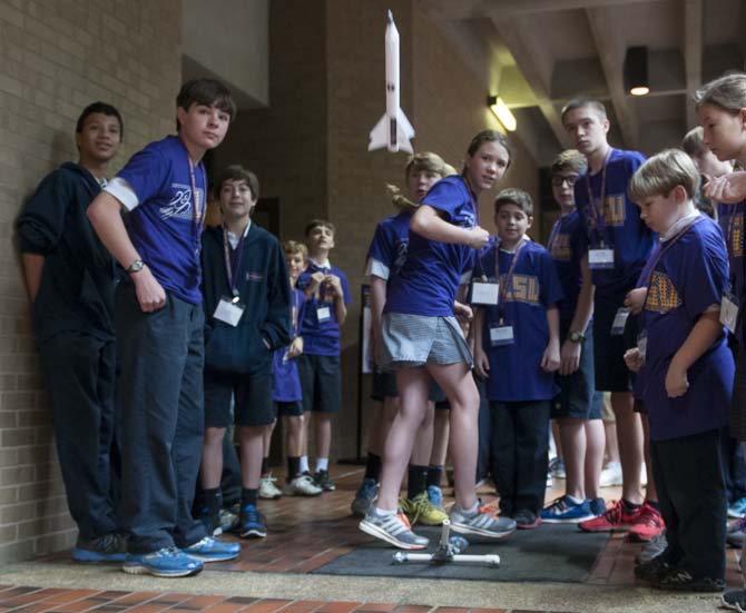 Middle school students launch a rocket Friday, March 28, 2014, during Space Day at Patrick F. Taylor Hall.