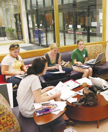 Students study and relax Wednesday night in Middleton Library. The University announced Thursday that the library will stay open Sunday through Thursday until 2 a.m. during a one-month trial period.