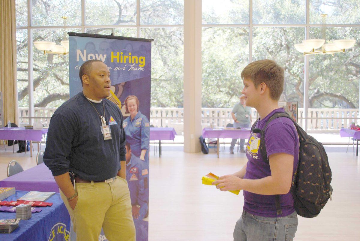 Zaanan Wheeler, Biological Engineer Junior, right, speaks to Terrance Sherrod, US Space and Rocket Center representative Thursday afternoon at the Career Services Job Fair in the Cotillion Ballroom.