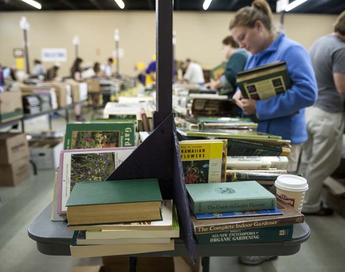 Horticulture grad student Sarah Bertrand browses through gardening books at the LSU Libraries Friends of the Libraries Annual Book Bazaar on Thursday, March 20, 2014 in the 4-H mini barn.