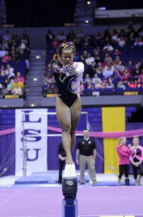 All-around gymnast Lloimincia Hall does her beam routine Friday, March 7, 2014 during the Tigers' 197.500 - 195.525 victory against NC State in the Pete Maravich Assembly Center.