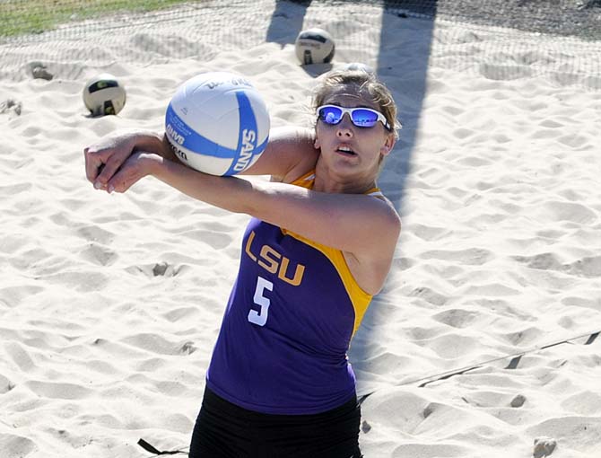 LSU sophomore Katie Lindelow (5) returns a volley Wednesday, March 12, 2014 during a scrimmage at Mango's Outdoor Volleyball.