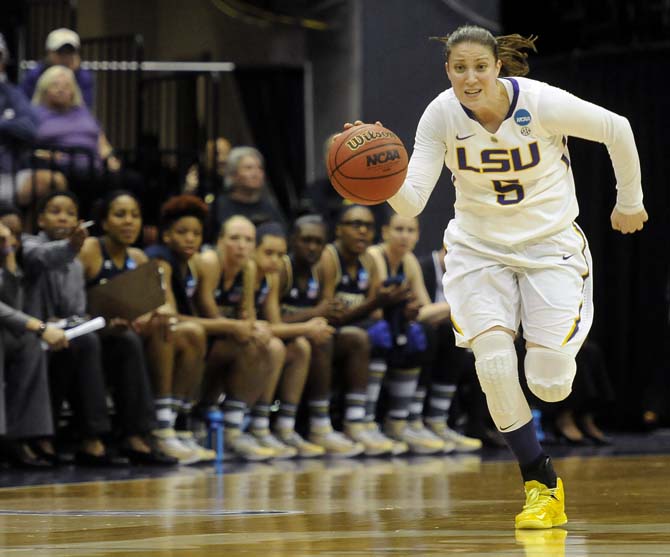 LSU senior guard Jeanne Kenney (5) moves the ball down the court Sunday, March 23, 2014, during the Tigers' 98-78 victory against Georgia Tech in the PMAC.