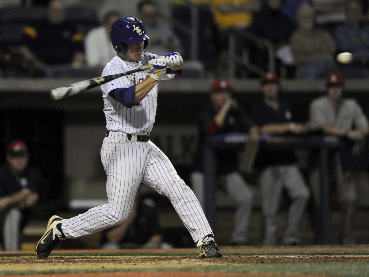 LSU sophomore infielder Alex Bregman (8) hits the ball during the Tigers' 9-0 victory against Southern Alabama on Wednesday, March 19, 2014 at Alex Box Stadium.