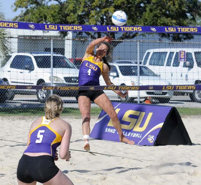 LSU senior Meghan Mannari (4) spikes the ball Wednesday, March 14, 2014 during a scrimmage at Mango's Outdoor Volleyball.